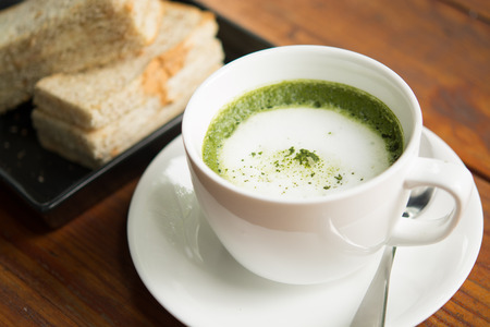 Green tea, milk, hot afternoon.の写真素材