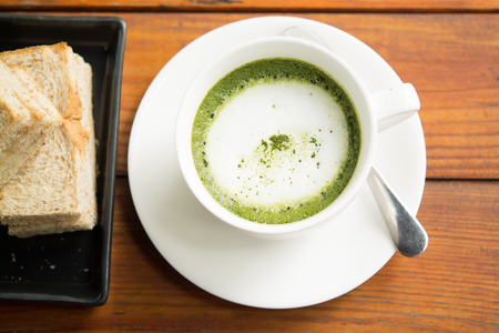 Green tea, milk, hot afternoon.の写真素材