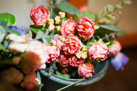 plastic flowers on the table in coffee shop.の写真素材