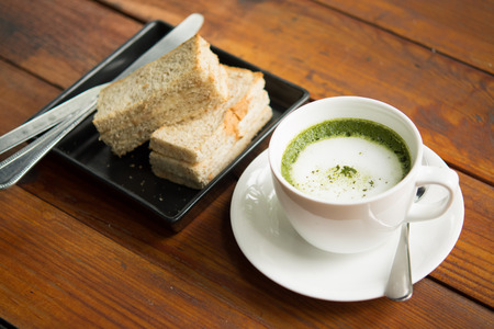 Green tea, milk, hot afternoon.の写真素材