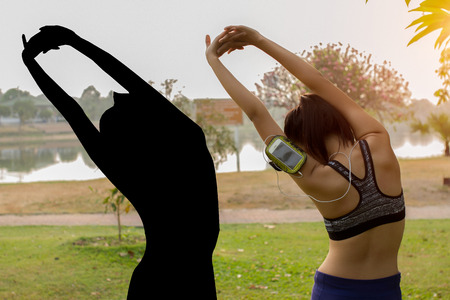Silhouette yoga in the park in Sunset time.