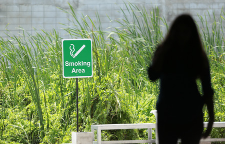 Smoking areas Park of men and women.の写真素材