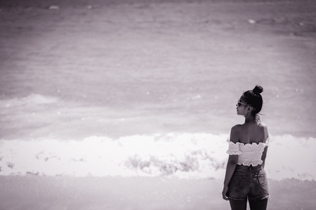 Asian girl by the sea in phuket beach.の写真素材