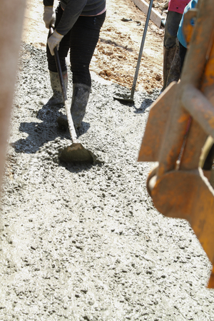 Pouring cement in the alley made by thai lebor.の写真素材