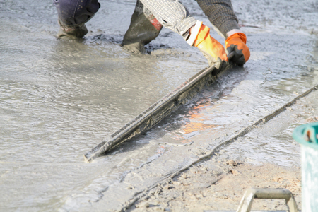 Pouring cement in the alley made by thai lebor.の写真素材