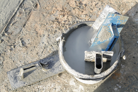 Pouring cement in the alley made by thai lebor.の写真素材