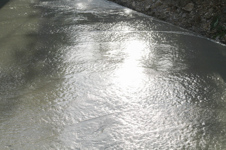 Pouring cement in the alley made by thai lebor.の写真素材