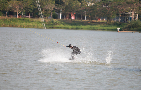 man Surfing at the water sports arena.の写真素材