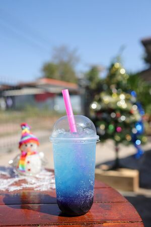 grape and blue water and soda on tableの写真素材