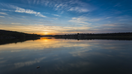 sunset on a bank of the river tajo in Extremadura in Spainの写真素材