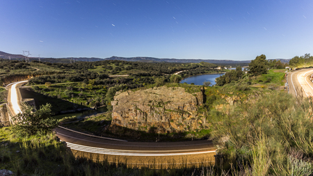 Night traffic image by a secondary roadの写真素材