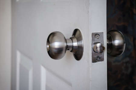 open door and door knobの写真素材
