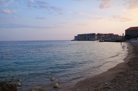 Banje Beach and Old Town at dusk - Dubrovnik, Croatiaの写真素材