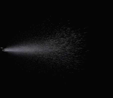 Spraying mist with black background