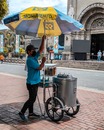 Ice cream vendor making a living through selling Ice Cream to the tourist.の写真素材