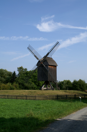 Historical Mill in Germany with green grass and blue Skyの写真素材