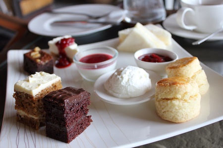 Dessert combination with cake, scone and sandwich.の素材