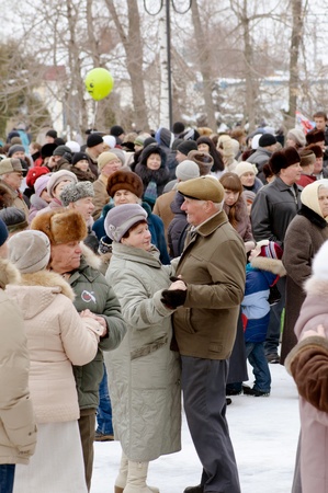 Dancing elderly pair on holiday in town park focus on vapour pair  in centreのeditorial素材