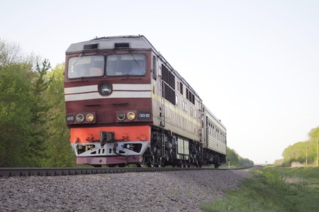 locomotive with passenger coach moves on branch lineのeditorial素材