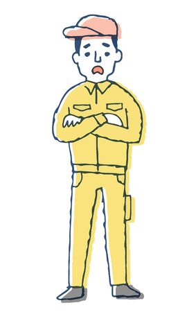 A man wearing work clothes with a troubled expressionの写真素材