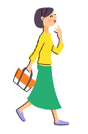 A woman walking with a smileの写真素材