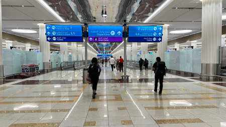 DUBAI, UAE. 16 SEPTEMBER 2023. Travelers moving towards departure gates in Dubai Airport, capturing journey's excitementのeditorial素材