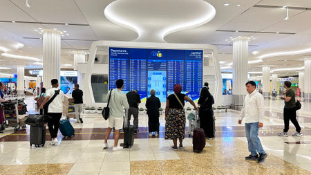 DUBAI, UAE. 16 SEPTEMBER 2023. Dubai Airportâs departure board is gazed at in anticipation of global journeysのeditorial素材