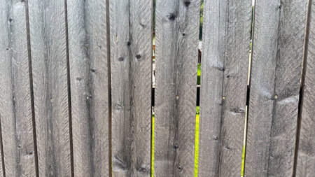 A rustic, wooden fence in detail, the picture captures nature's beauty in its grain and color variationsの写真素材