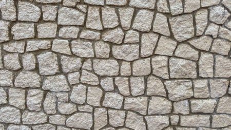 Close-up of textured stone wall, showing intricate patterns and earthy tonesの写真素材