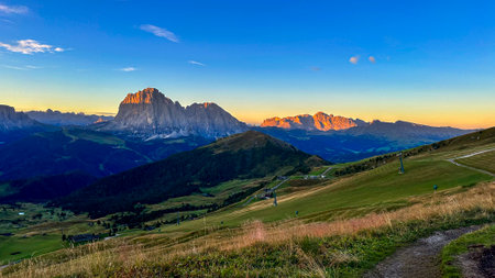 From Seceda peak in Italy's Dolomites, witness a breathtaking panorama. Trentino Alto Adige, Europe. Morning reveals the majestic Furchetta peak in the Alps.の写真素材