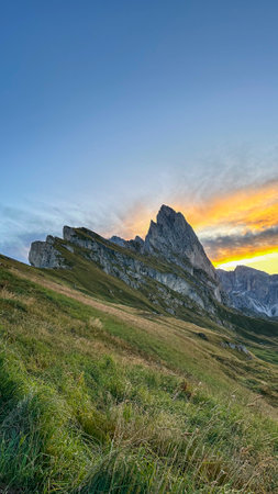 Dolomite spires touch the sky, a tapestry of nature's grandeur in sun-drenched Italy.の写真素材
