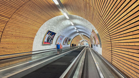 ORTISEI, ITALY. 18 SEPTEMBER 2023. An escalator in a wood-paneled tunnel in Ortisei, Italy, ascends to the Seceda cable car, gateway to the Dolomites' peaks.のeditorial素材
