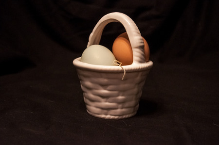 Farm fresh eggs in a glass basketの写真素材