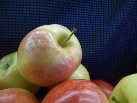 A pile of apples on display in supermarket.の写真素材