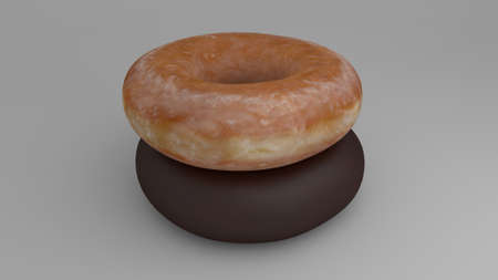 glazed donut stacked over a chocolate donutの写真素材