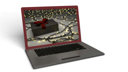 Laptop with Christmas background isolated in white.の写真素材