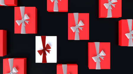 Unique and special Christmas Gift surrounded by red gift boxesの写真素材