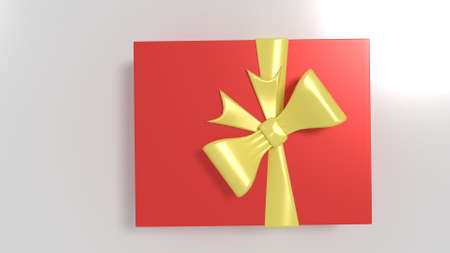 Red Christmas or Valentines Gift box with Gold ribbon isolated in whiteの写真素材