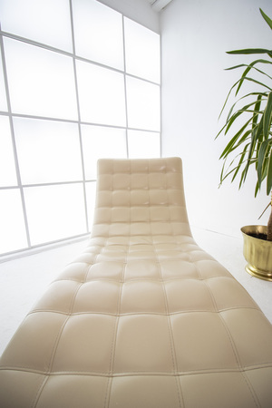 Upholstered daybed in white roomの写真素材