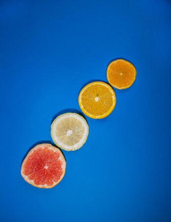 Sliced citrus on a blue backgroundの写真素材