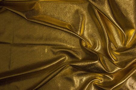 Texture of fabric Golden fabric wave backgroundの写真素材