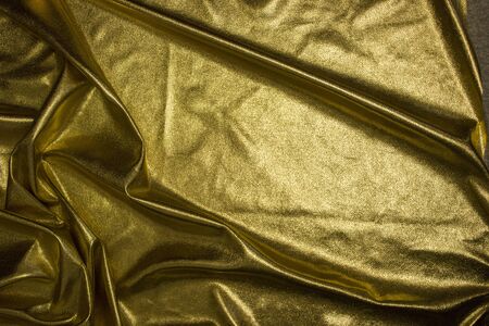 Texture of fabric Golden fabric wave backgroundの写真素材