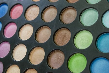 Palette of colored eyeshadows, close-up.