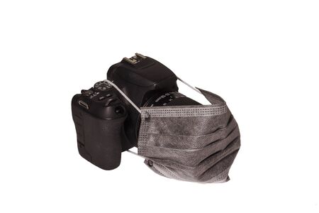 camera with medical mask, concept coronavirus photo isolated on white backgroundの写真素材