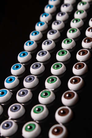 doll eyes pattern on black backgroundの写真素材