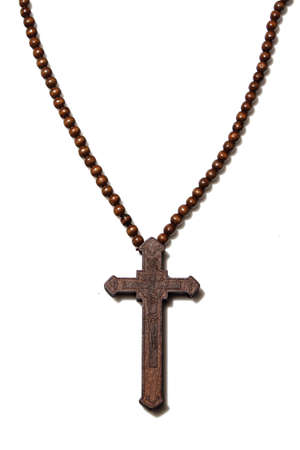 Wooden christian cross necklace isolation on whiteの写真素材