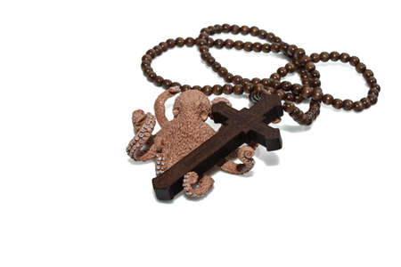 Wooden christian cross necklace isolation and Octopus on white background with free spaceの写真素材
