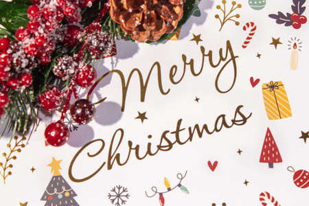 Christmas Decoration with snow. Holiday Decorations Isolated on White Background. Fir wreath decorated with red berries and toys,の写真素材