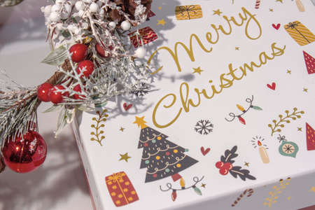 Christmas Decoration with snow. Holiday Decorations Isolated on White Background. Fir wreath decorated with red berries and toys,の写真素材