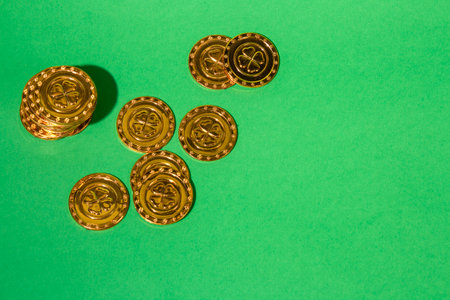 St Patrick's Day gold coins with shamrock on a green background. Copy space for textの写真素材
